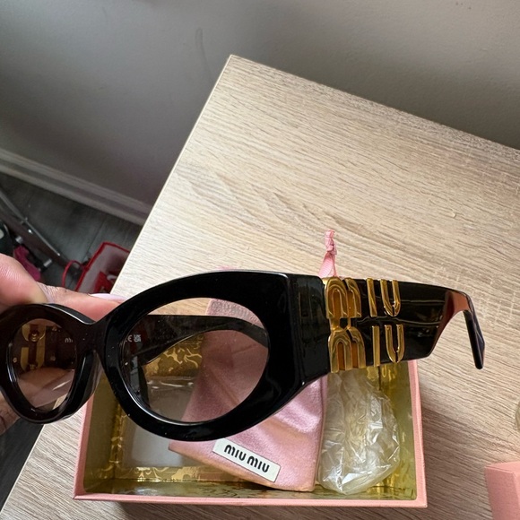 Miu Miu Black Sunglasses with Gold Detailing main image 5